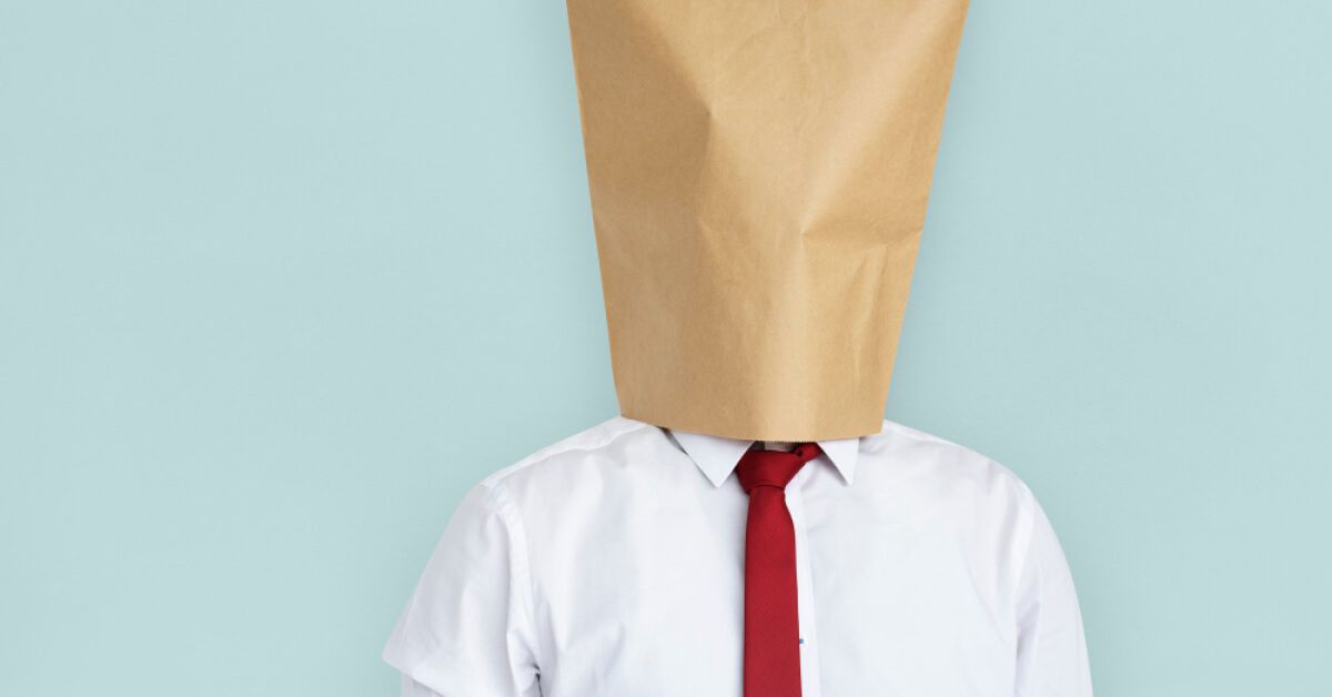 Person wearing a paper bag on their head