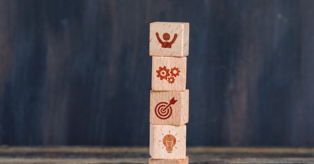 Stack of wooden blocks with vector visuals on them