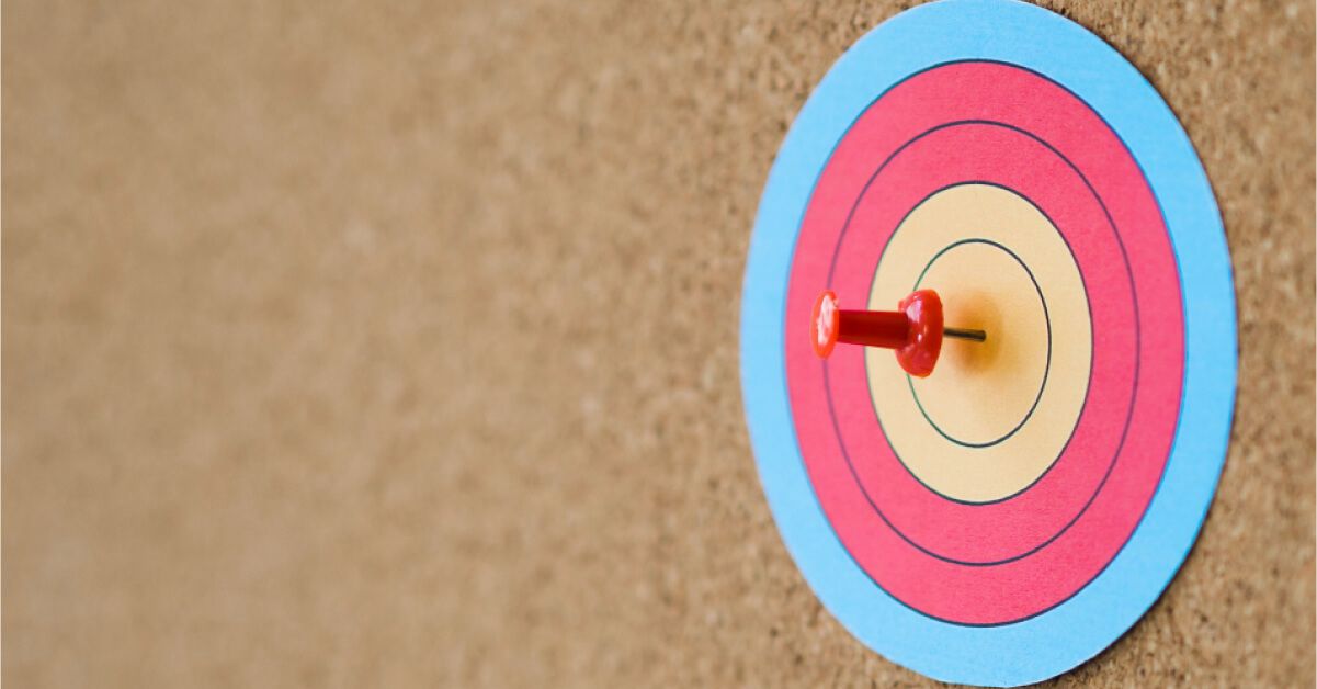 Red pin on a target board