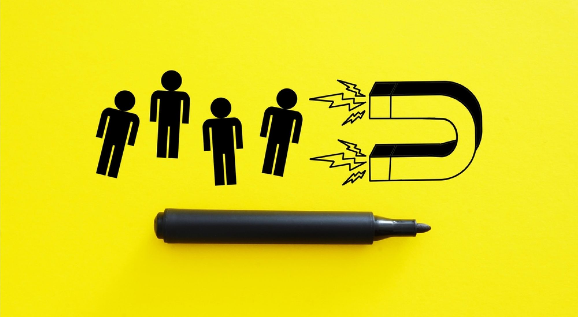Marker drawing of employees being attracted with a magnet