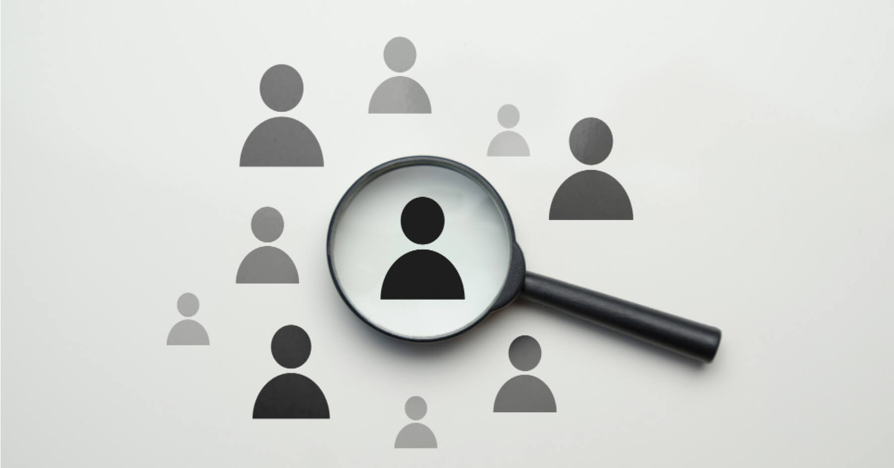 Zooming in on employee signs with a magnifying glass