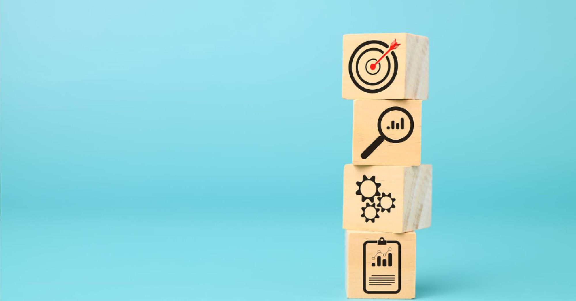 Stack of wooden blocks with vector visuals on them