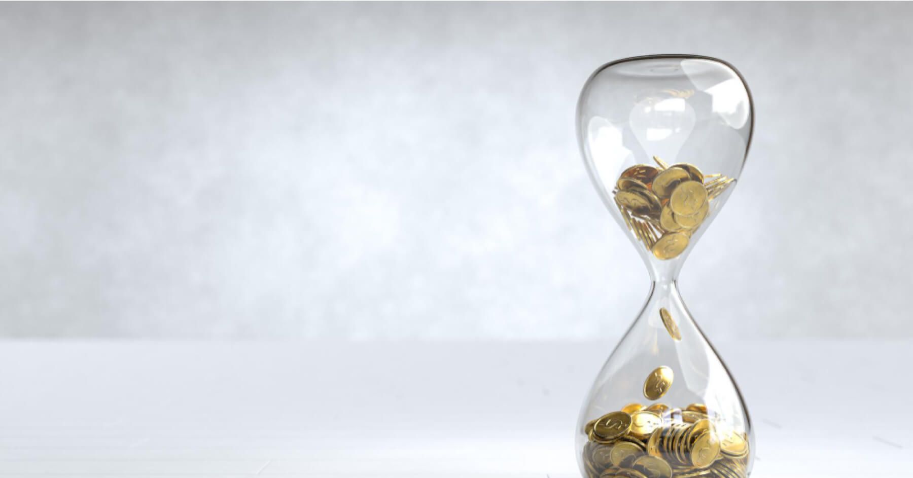 Hourglass with gold coins inside it