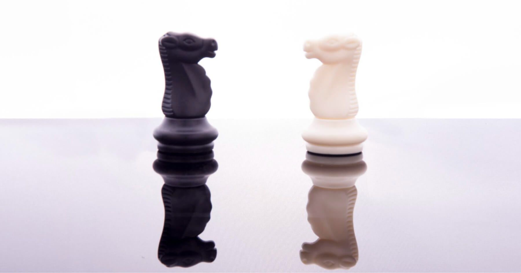 Close-up of chess pieces against white background