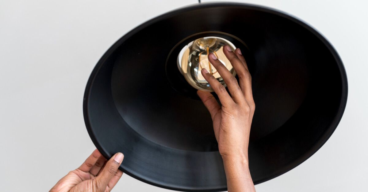 Woman fixing a bulb