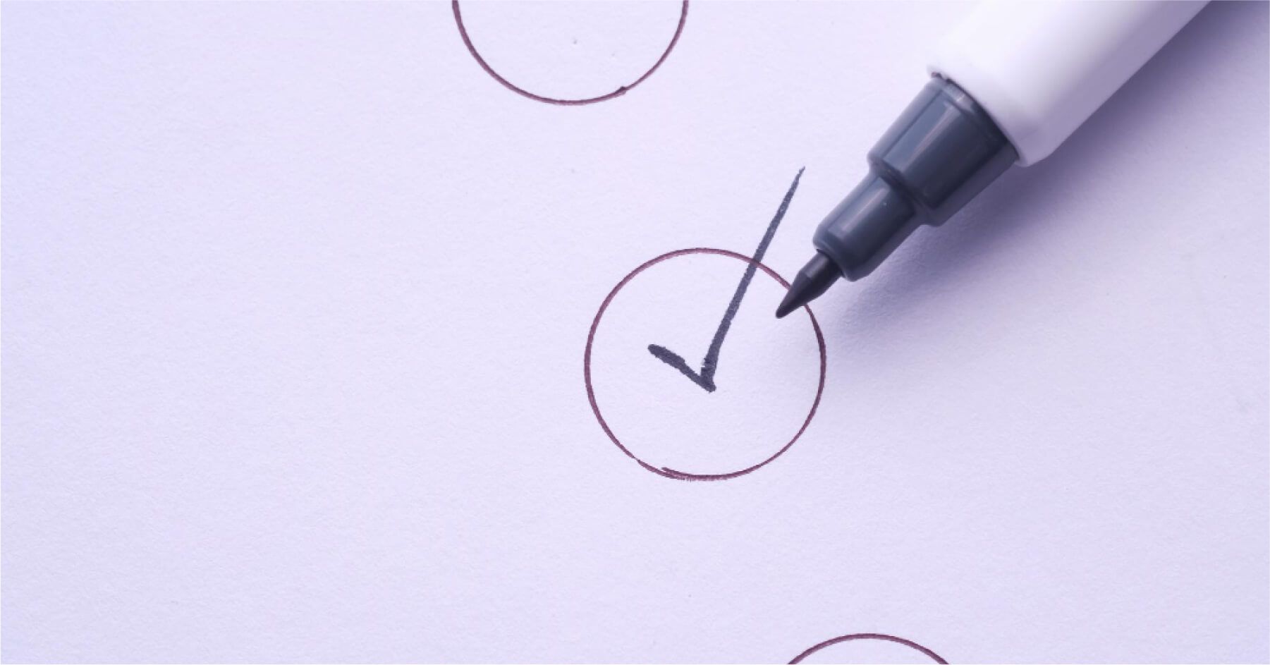 Marker next to a ticked checklist