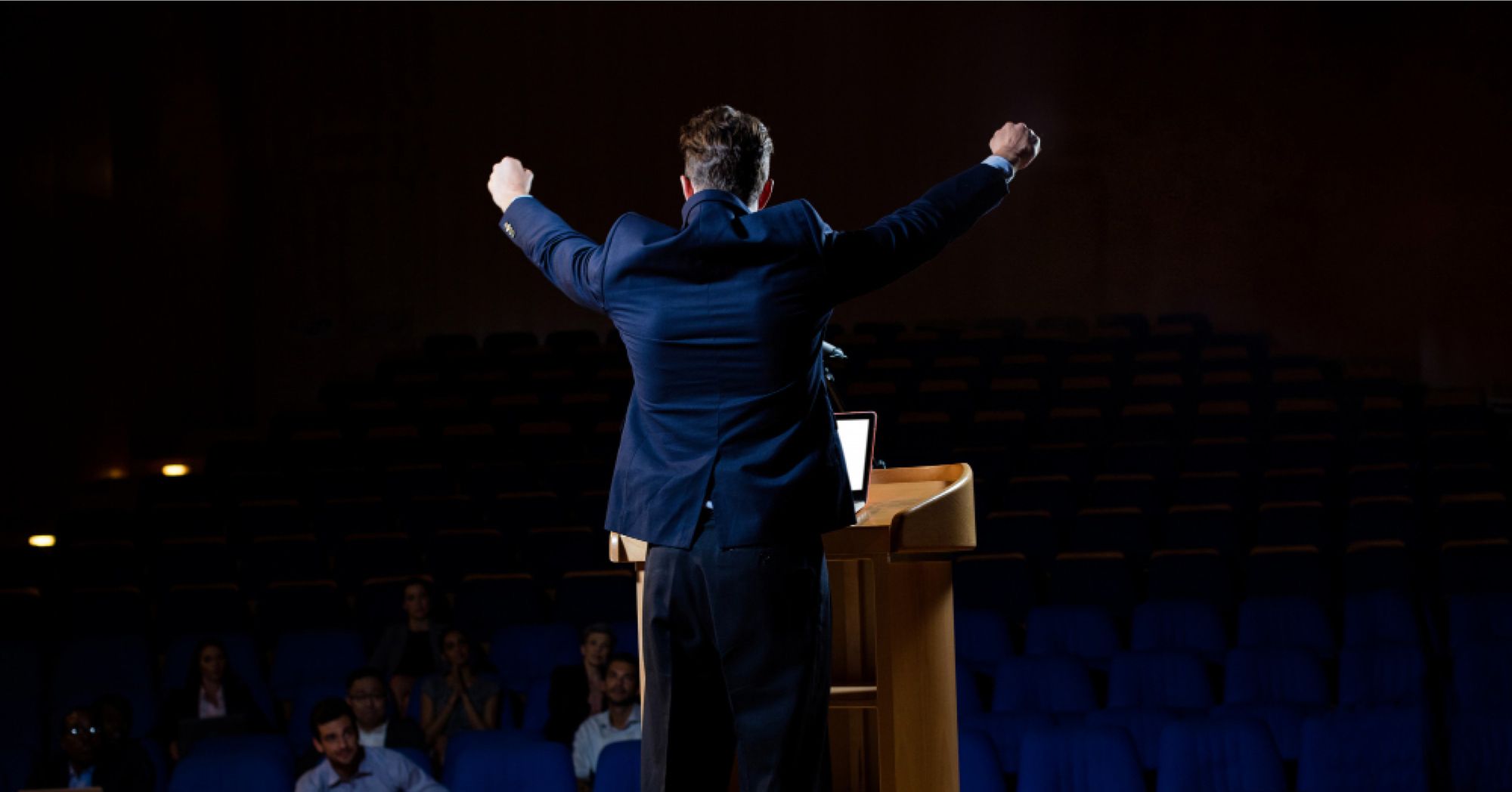 A conductor conducting an orchestra