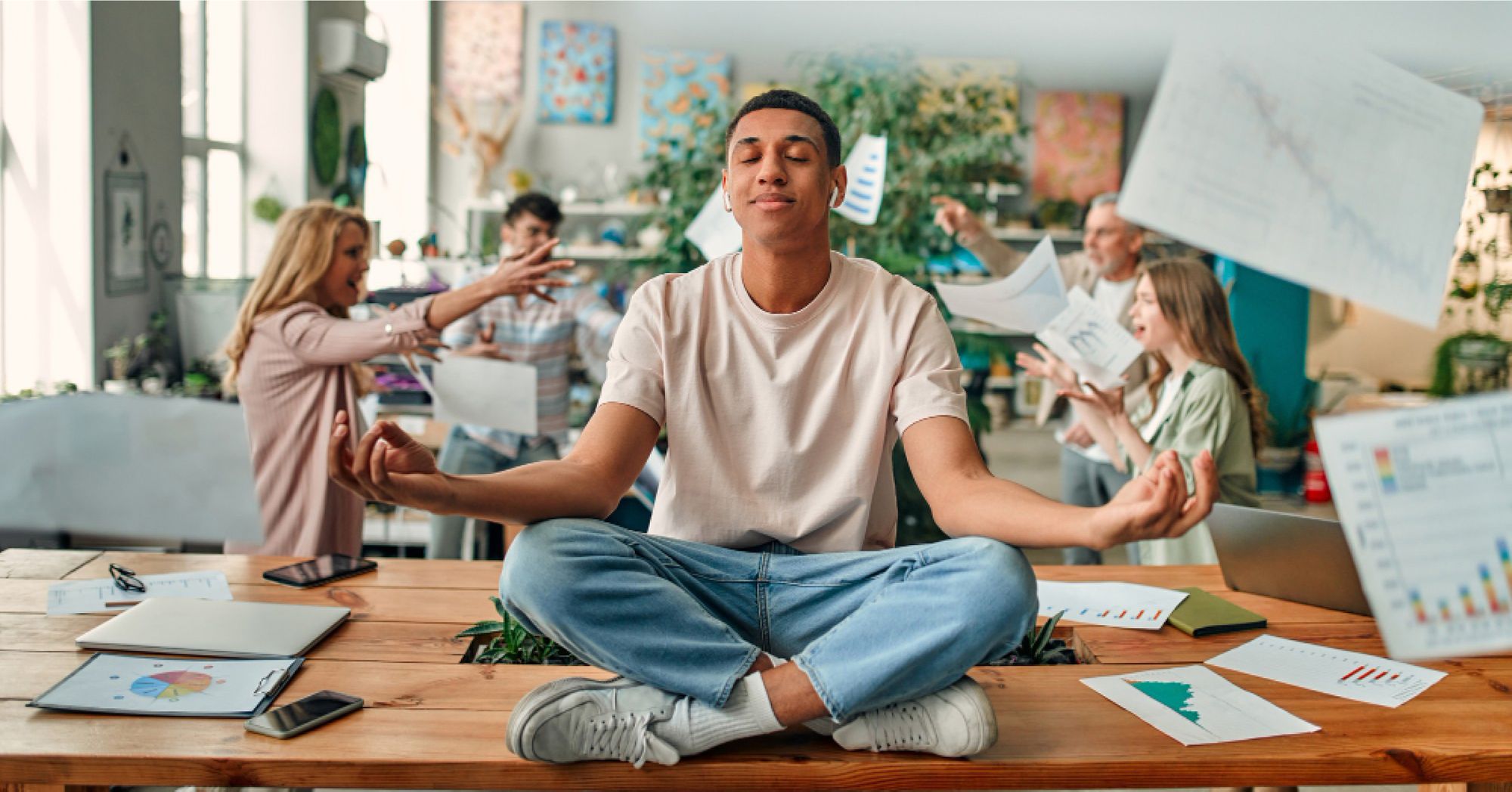 Chill guy meditating when everyone in his office is freaking out