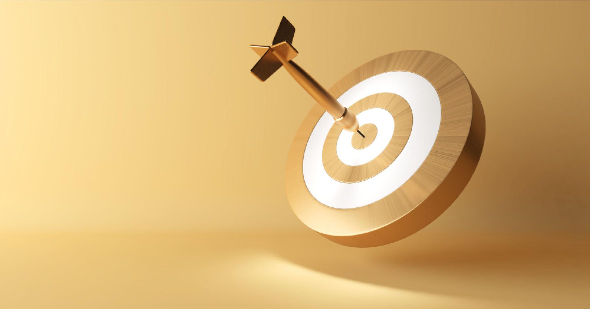 A gold arrow hits a gold dart aim
