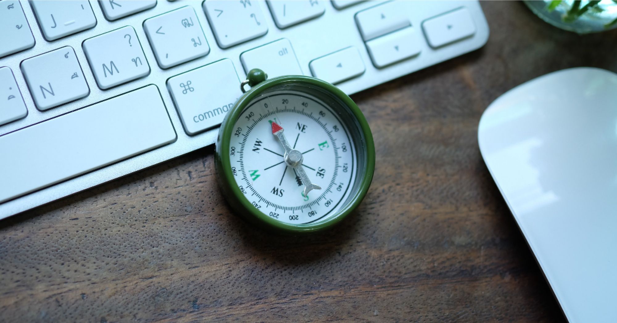 A compass against a workdesk