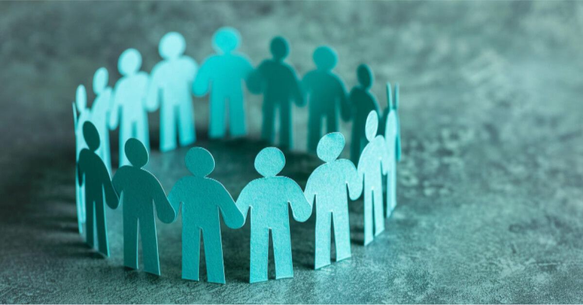 Blue cutouts of humans in chart, arranged in a circle holding hands