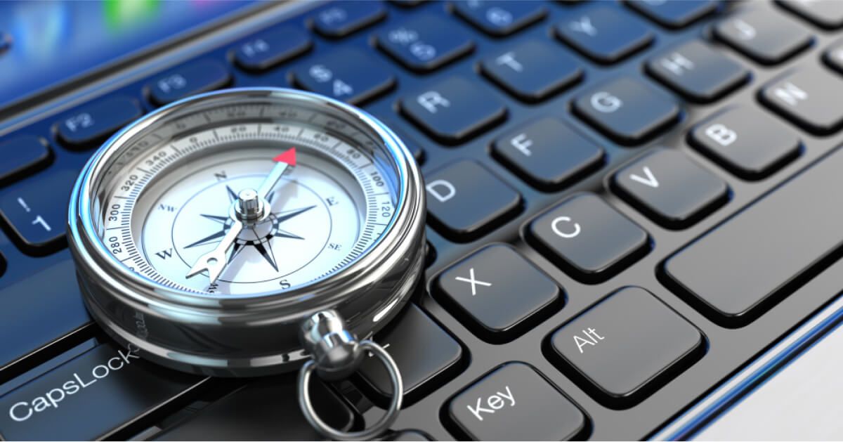 A compass against a workdesk
