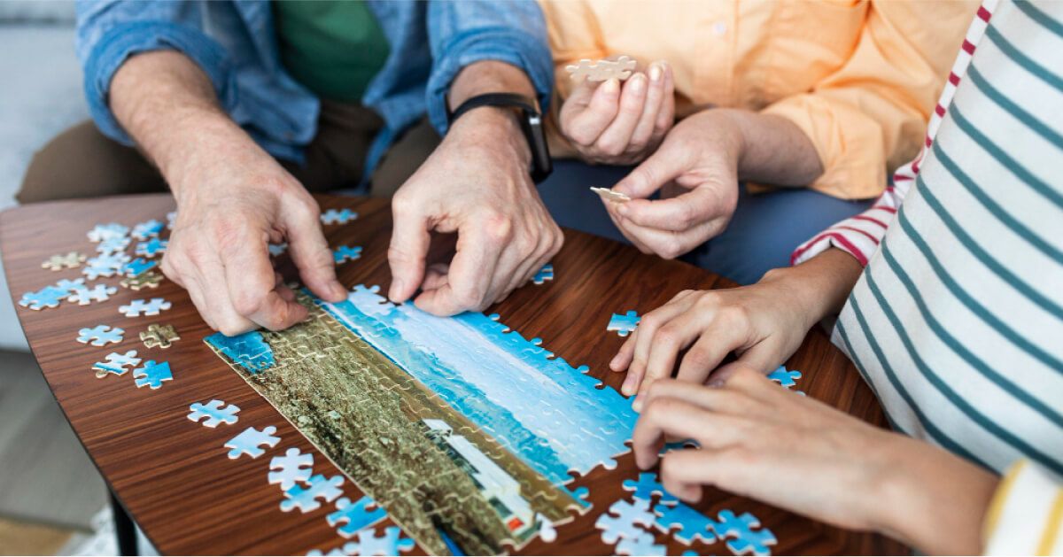Employees fitting a puzzle