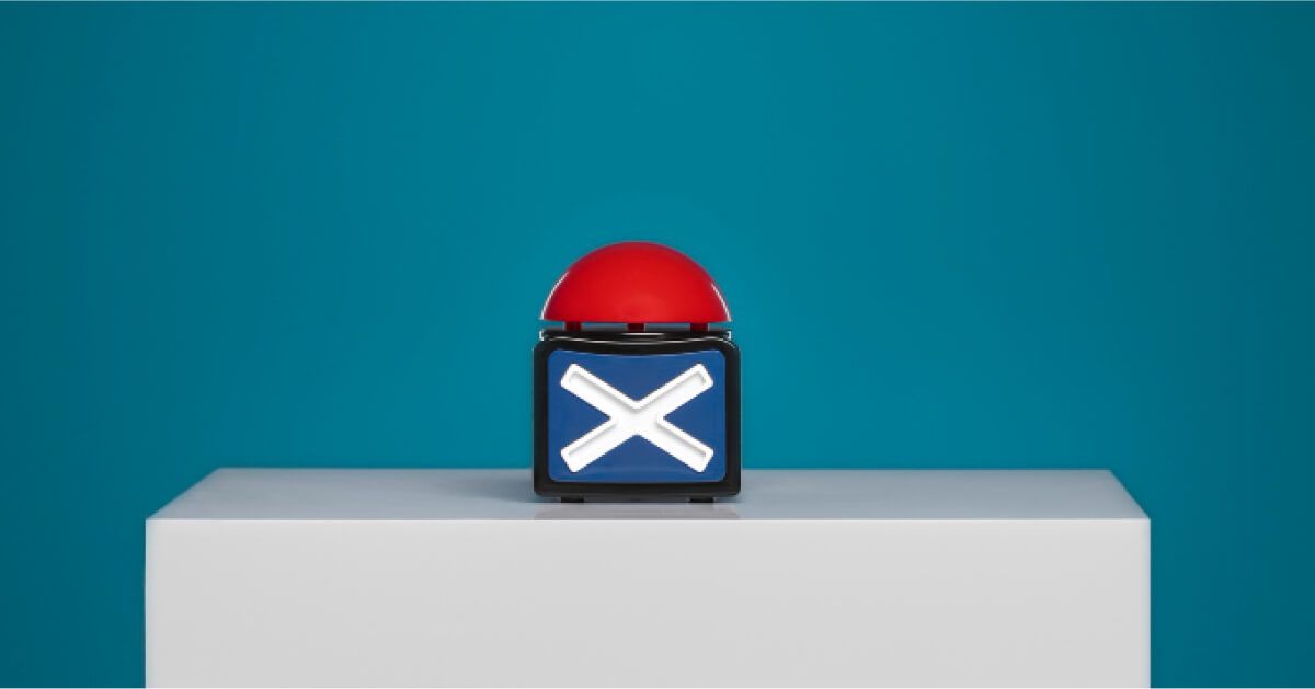 Red buzzer over a white table