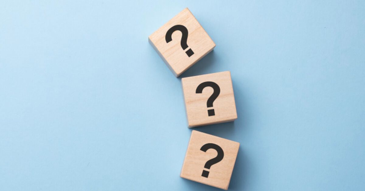 Wooden blocks with question marks on them