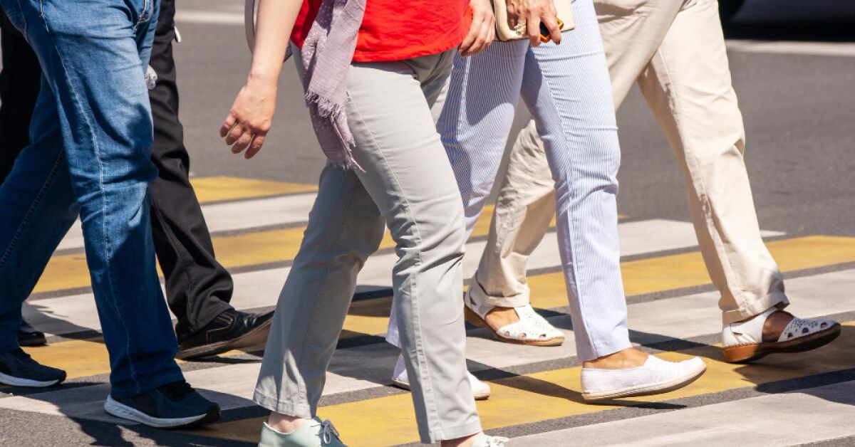 Group of people walking on a crosswalk