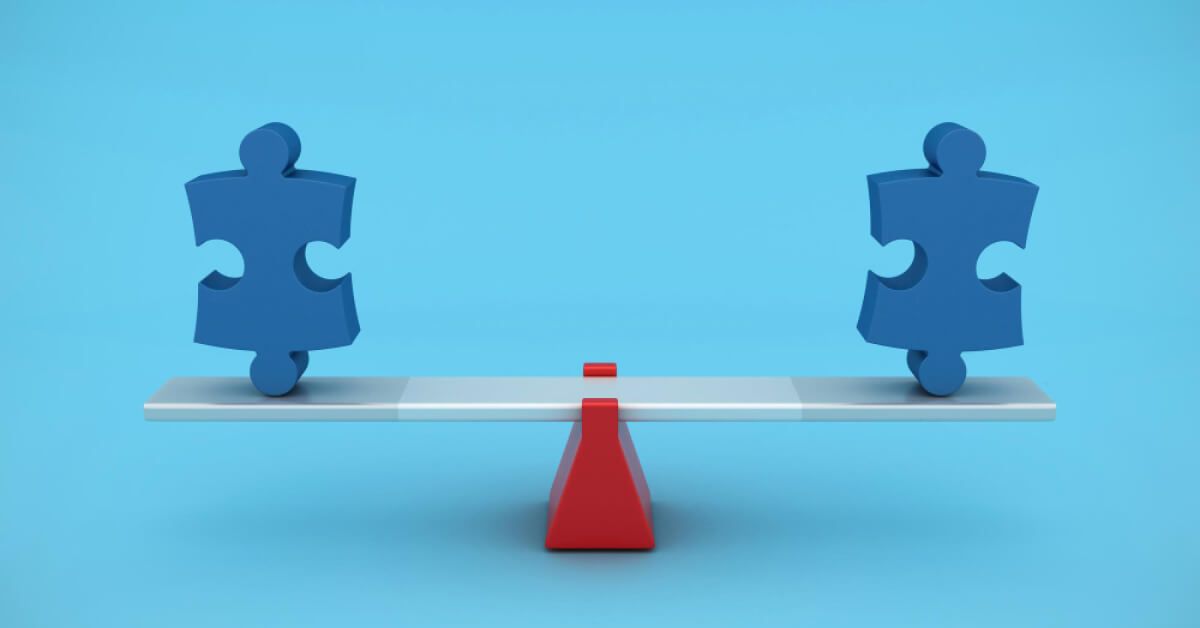 Two puzzle pieces on edges of a balanced surface