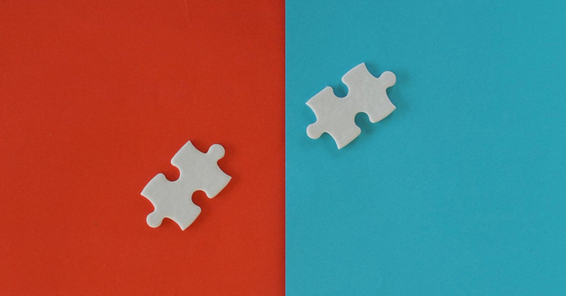 White puzzle pieces against red and blue backdrops