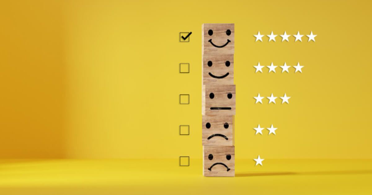 Stack of wooden blocks with reactions on them and checkboxes next to them