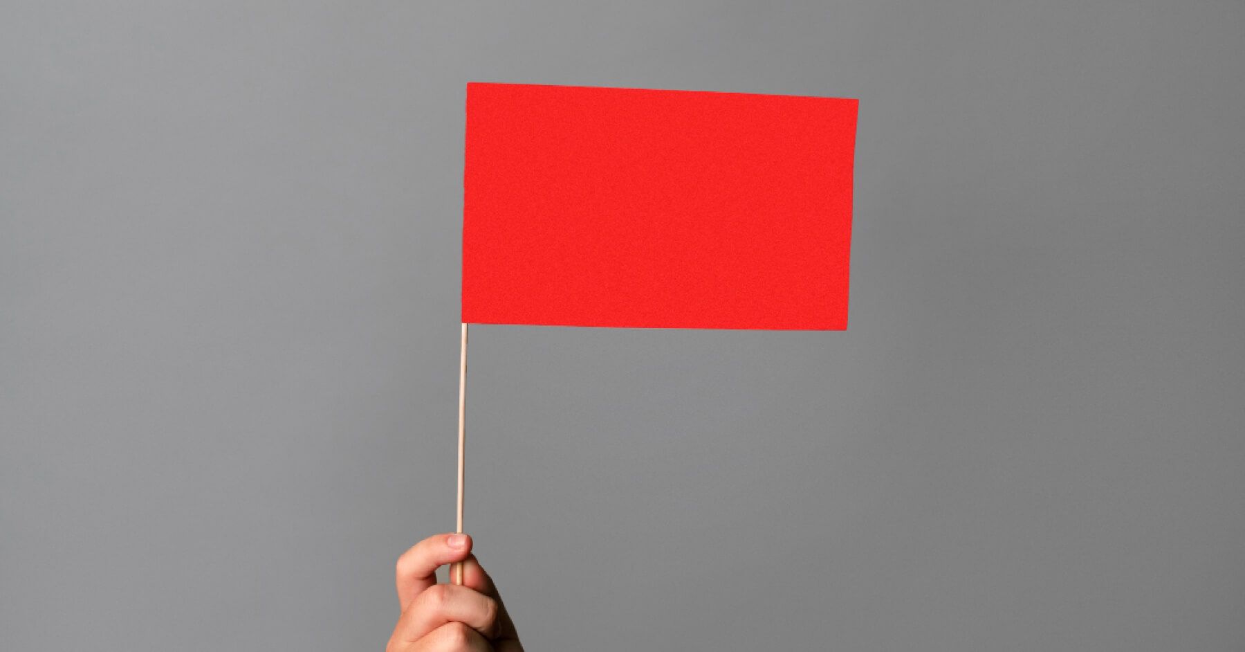 Person holding a red flag