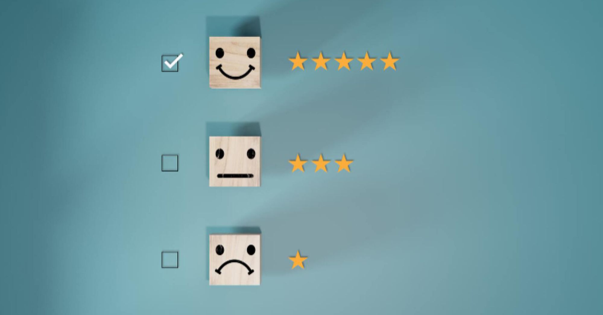 Wooden blocks of emotions ranked next to stars