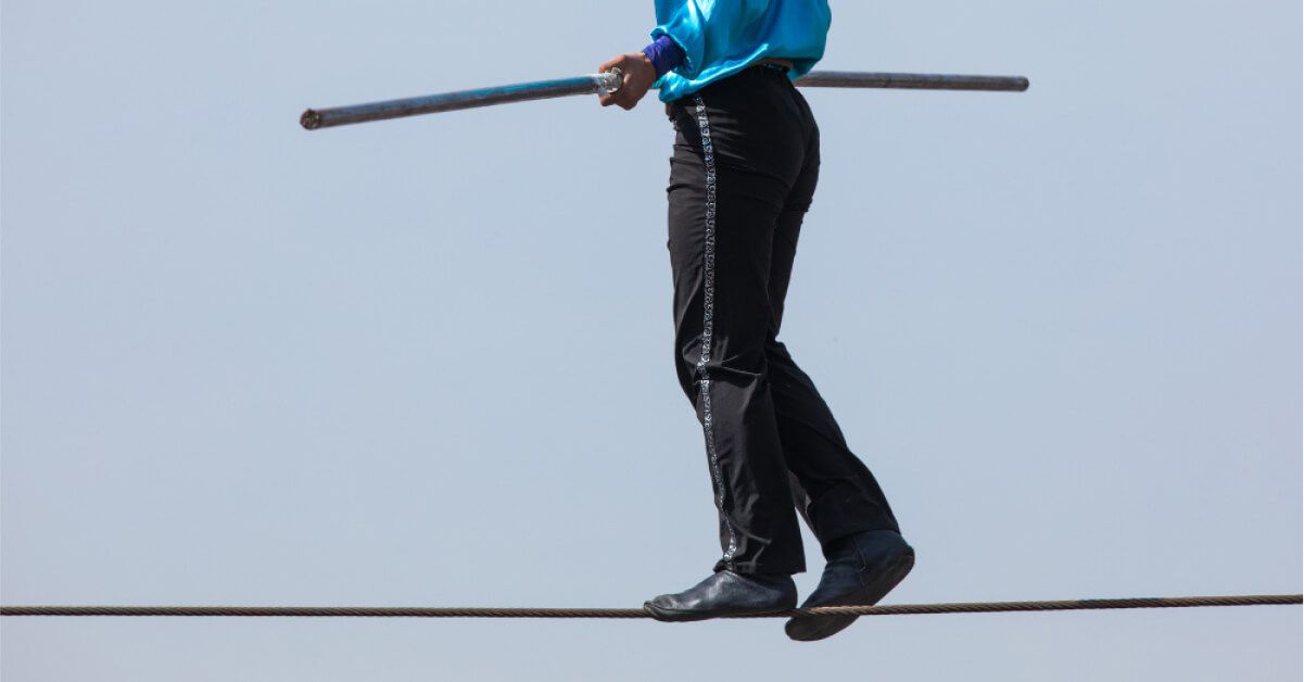 A man tightrope walking