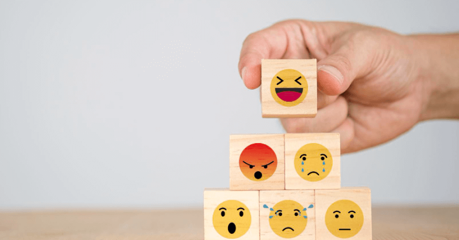 Wooded square blocks with different emojis 