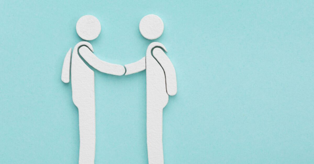 Figurines participating in a handshake