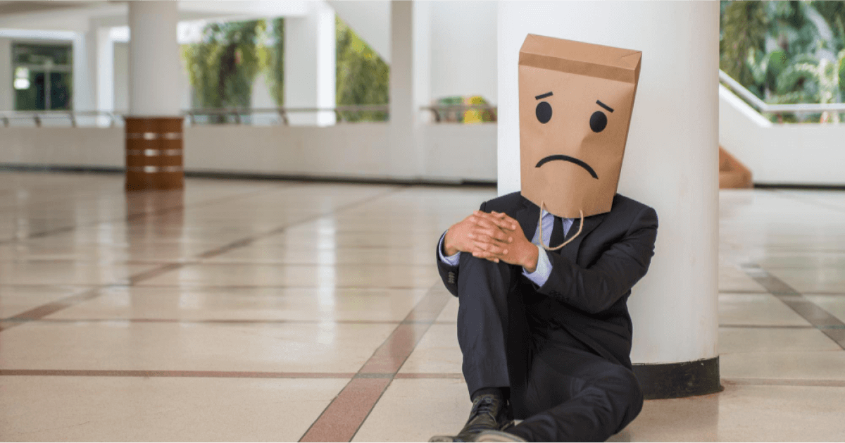 Paper bag covered over a stressed person