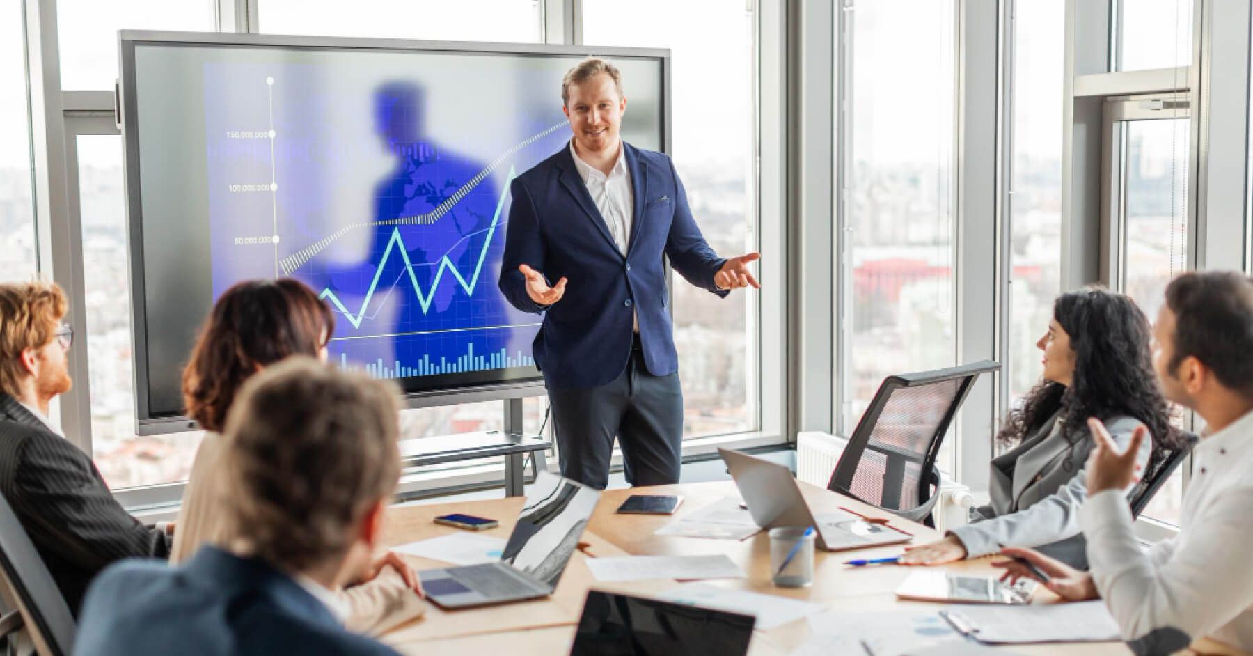 Person presenting analytics in a team meeting