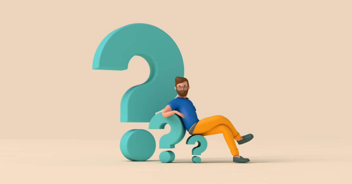 Employee sitting on a giant question mark