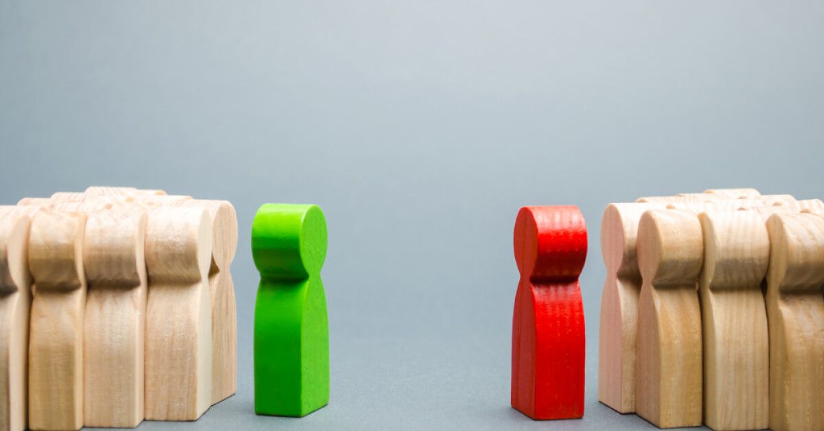 Wooden humans facing each other