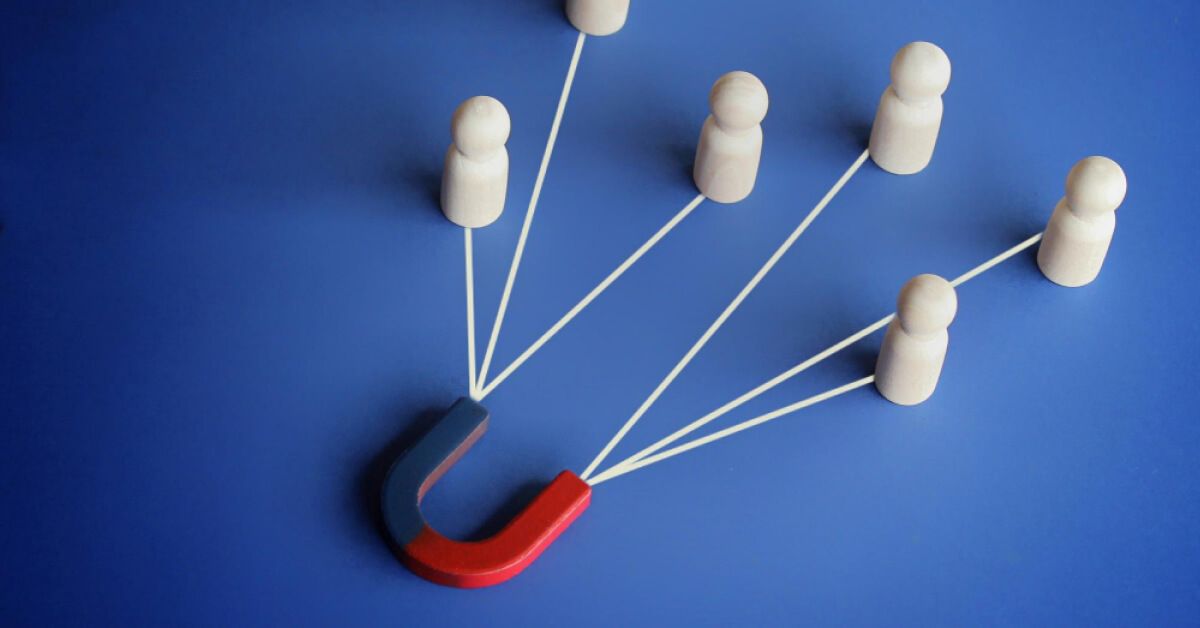 Magnet attracting wooden human figures