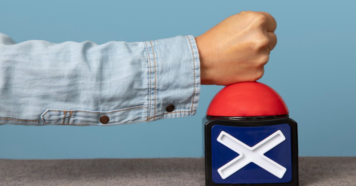 A person pressing a wrong buzzer
