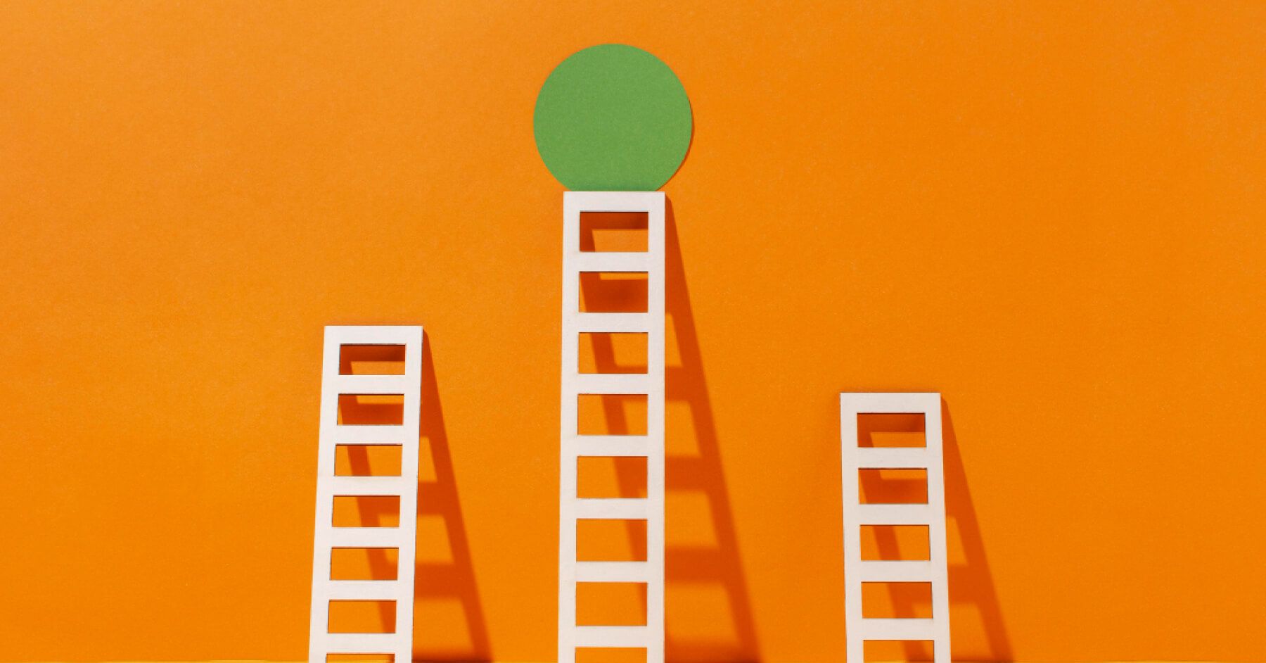 Ladders leading to a green circle