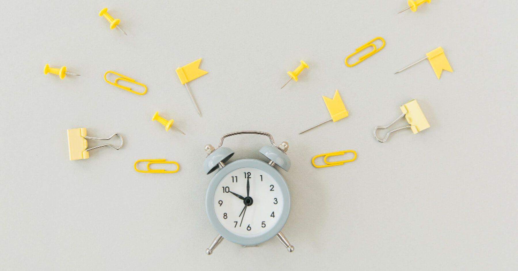 Clock surrounded by yellow pins