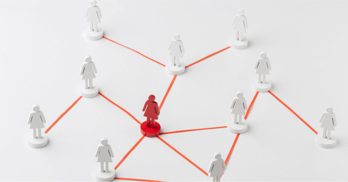 Red figurine along with a network of white figurines