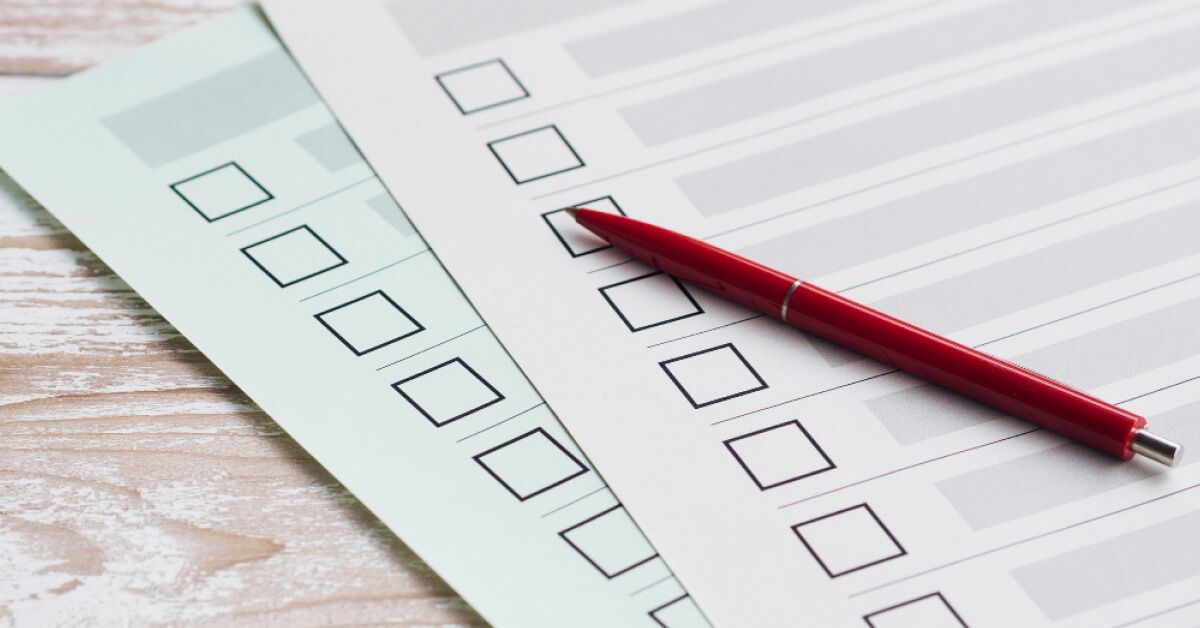 Red pen over feedback forms