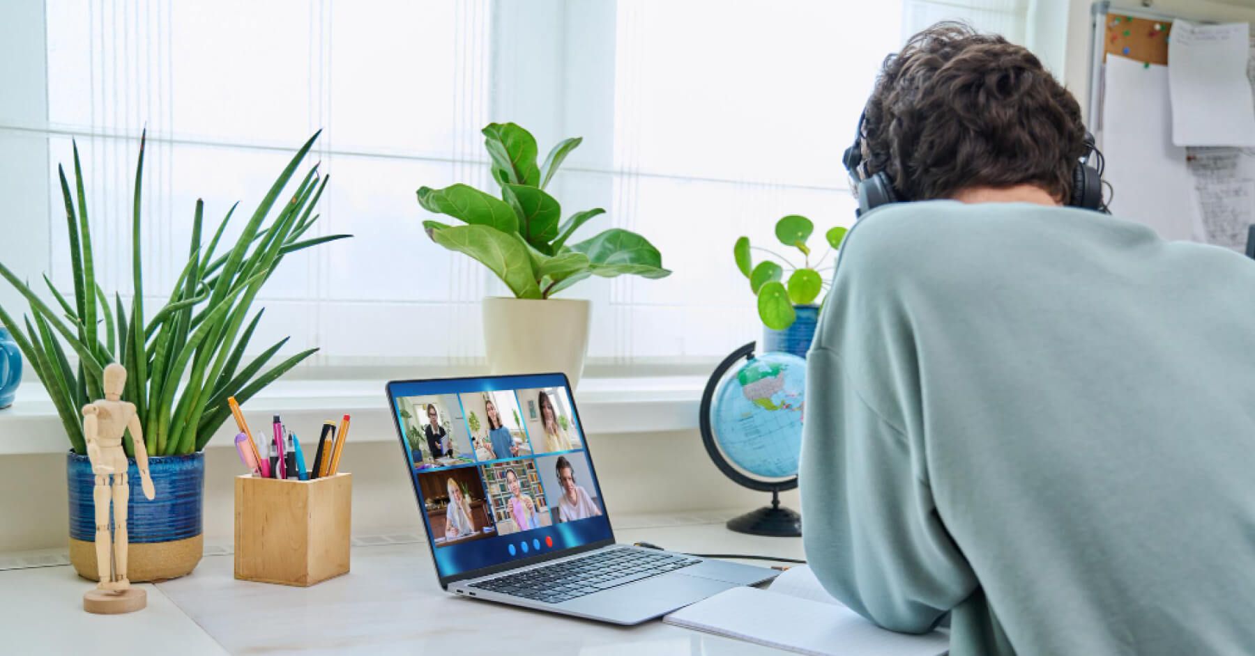 Employee attending a remote meeting through laptop