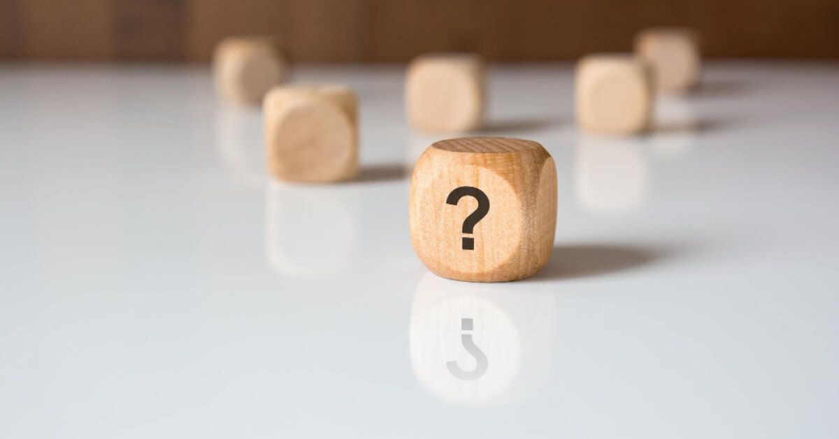 Wooden cube with a question mark