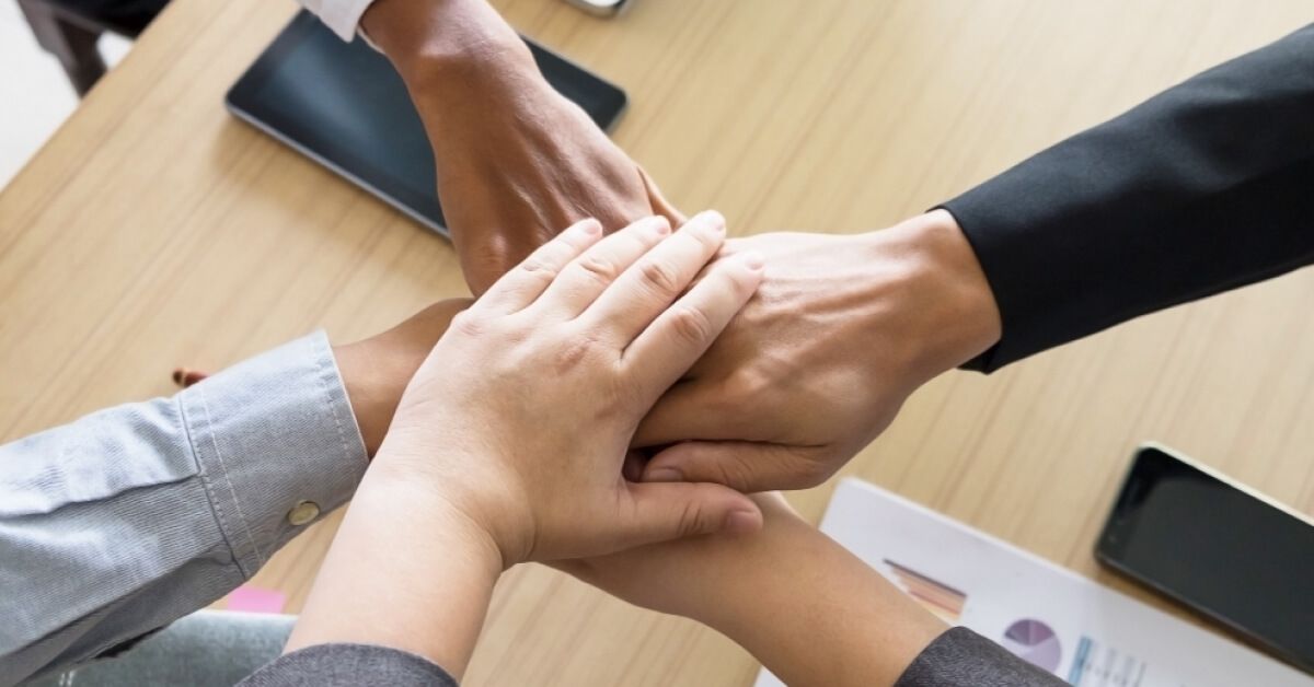 Employees coming together for a cheer