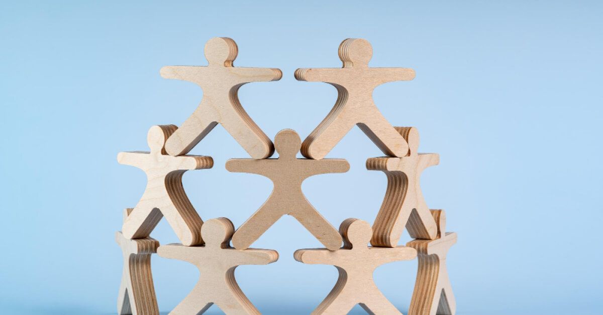 Wooden pawns forming a sphere