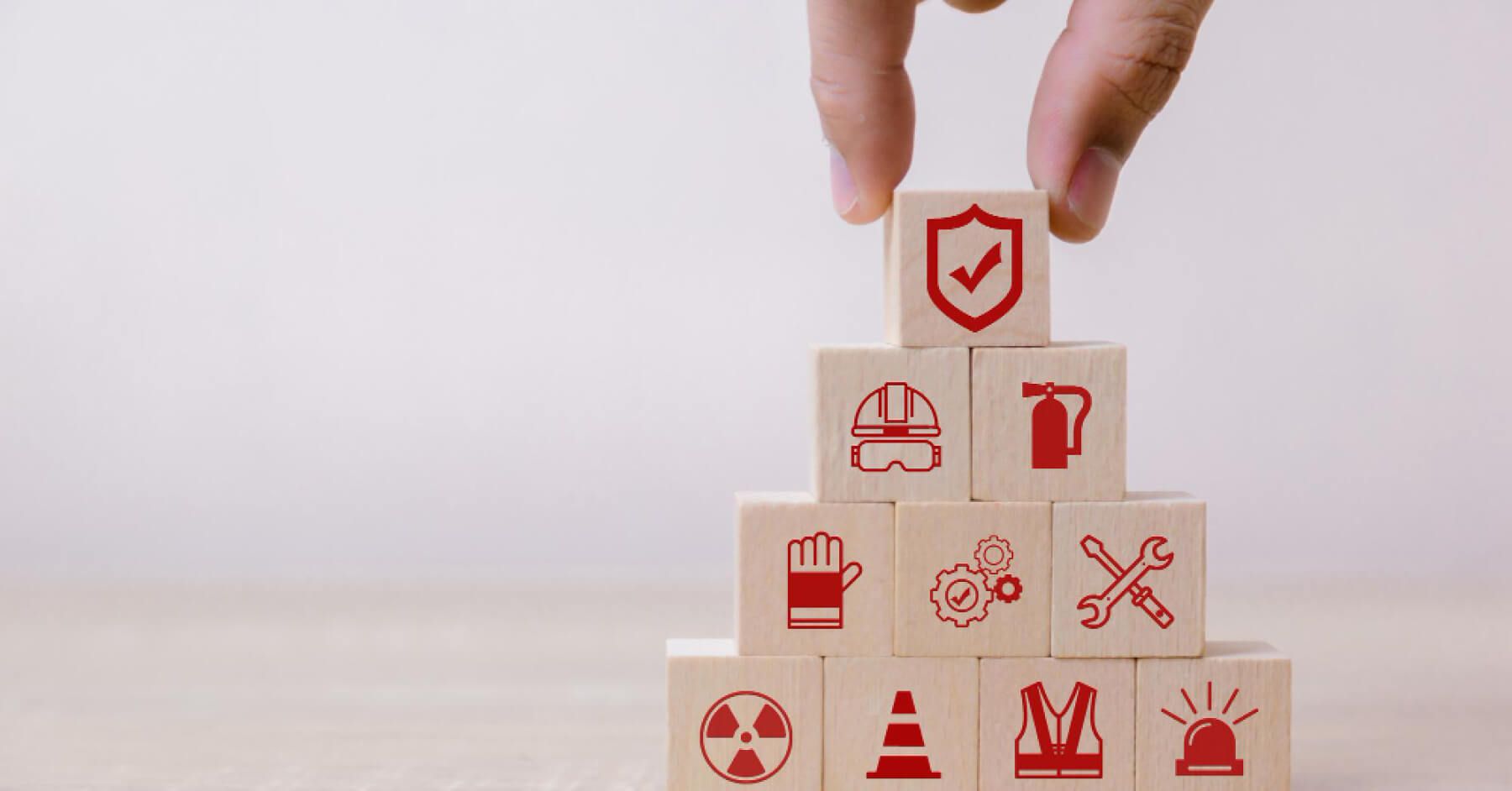 Stack of safety logos on wooden blocks