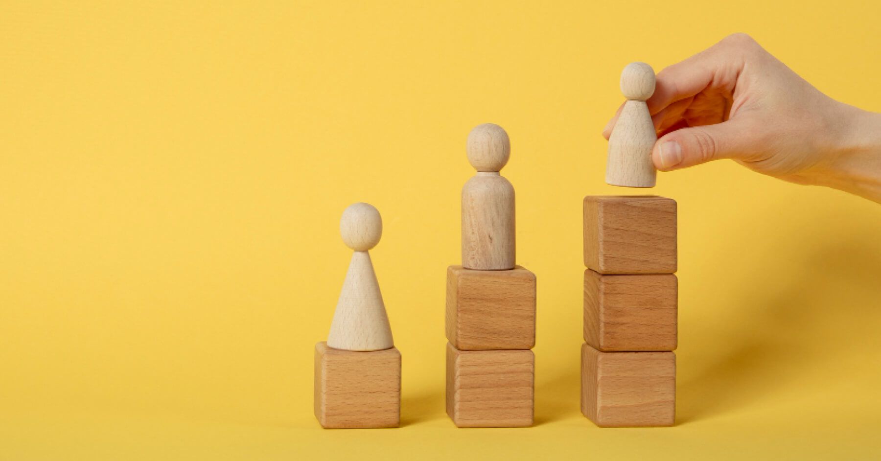 Wooden pawns on wooden blocks
