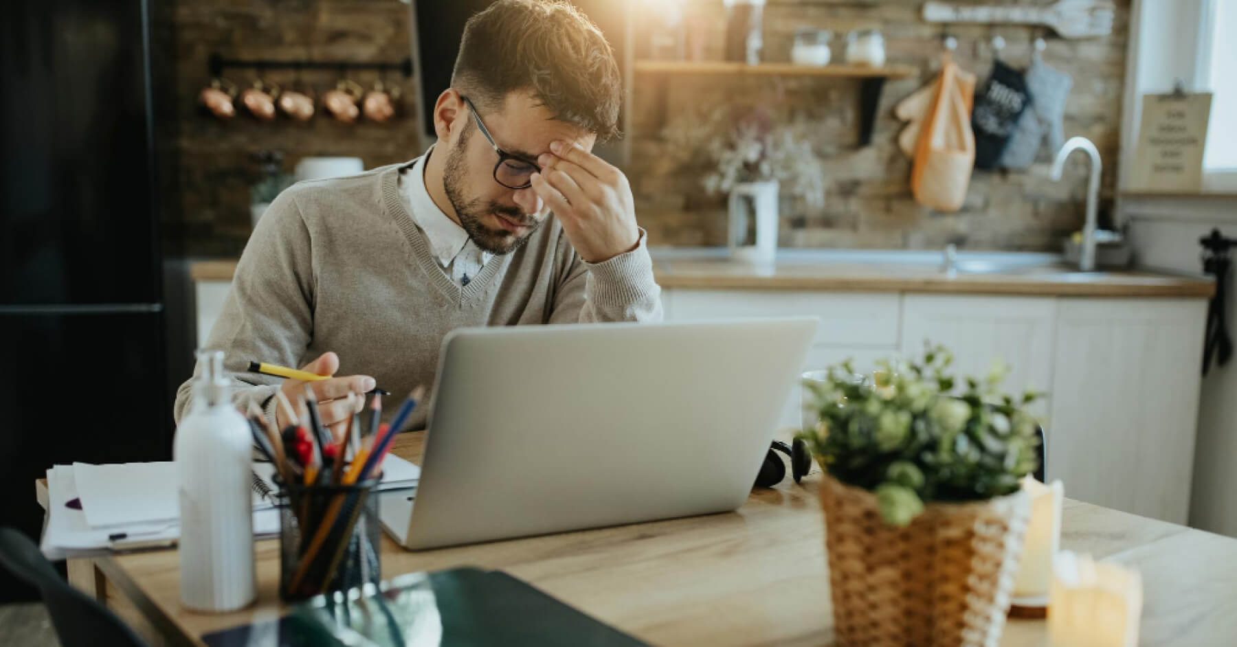 Frustrated employee in front of a laptop screen