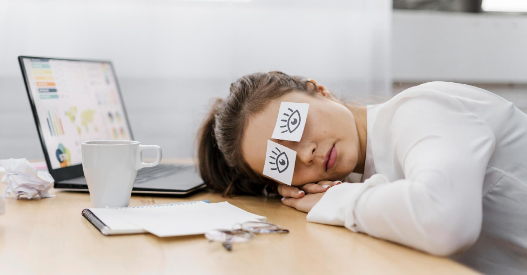Burnt out employee in front of a laptop
