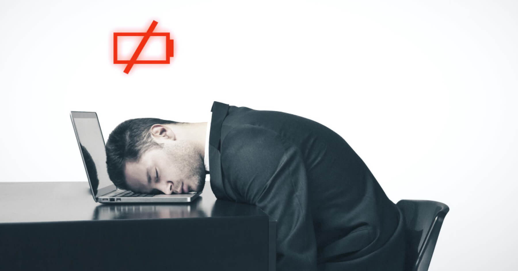Burnt out employee lying on a workdesk