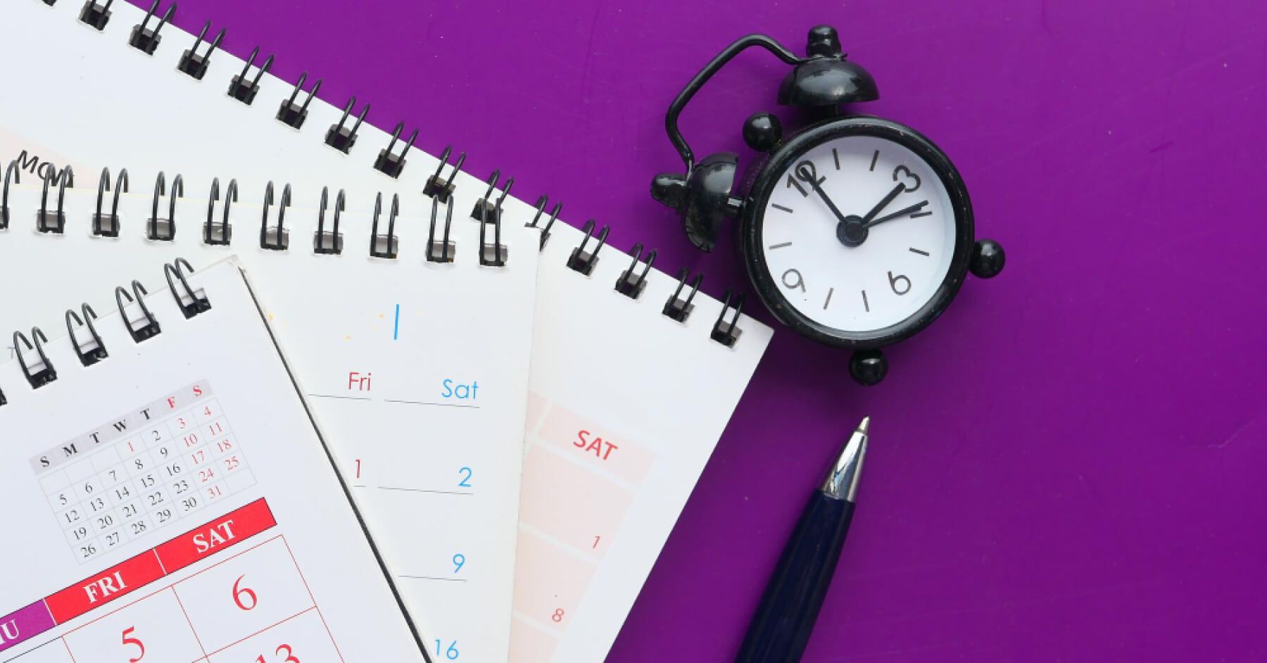 Calendar, clock and a pen