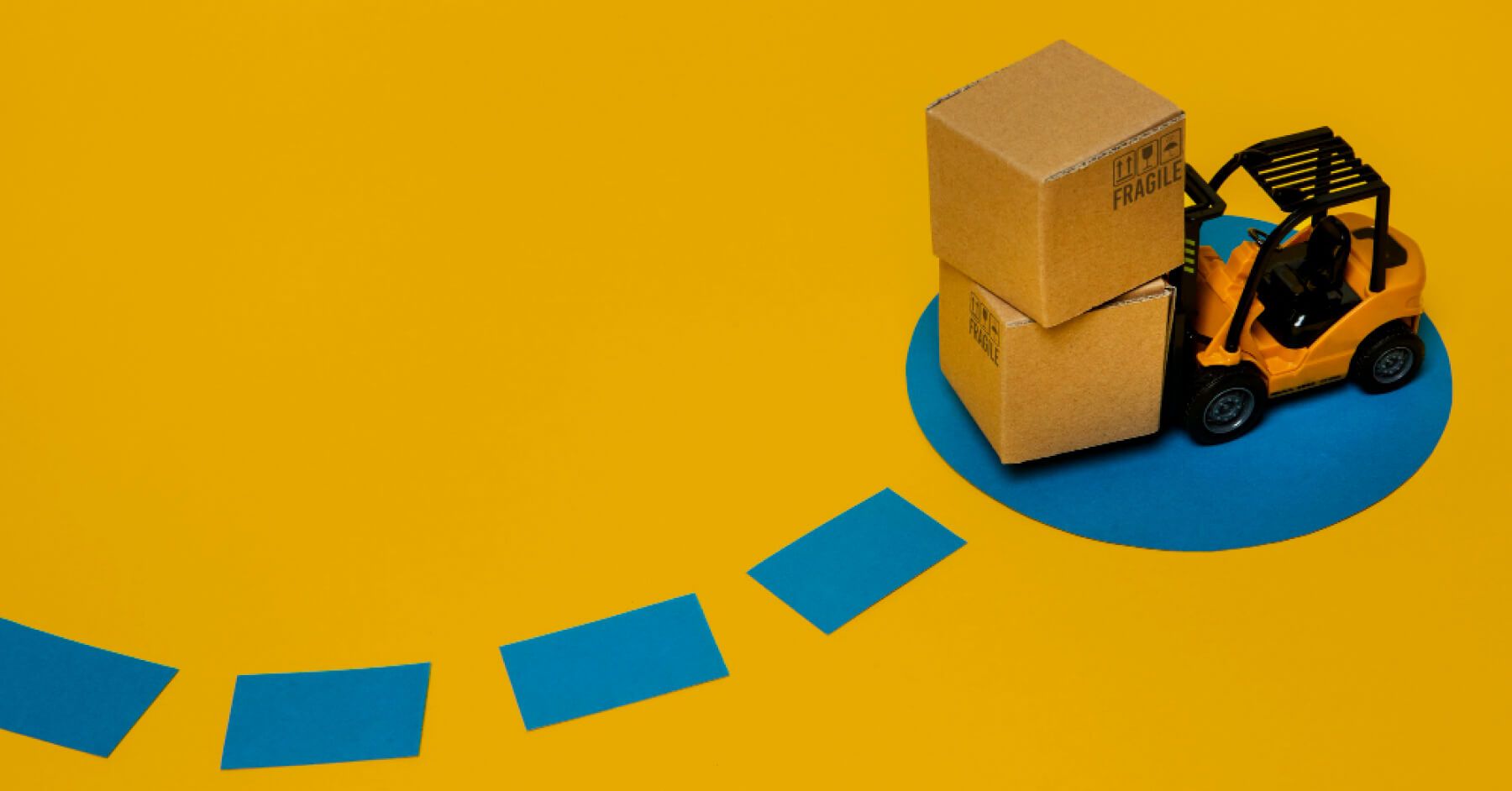 Toy crane with boxes, leaving a dotted blue trail