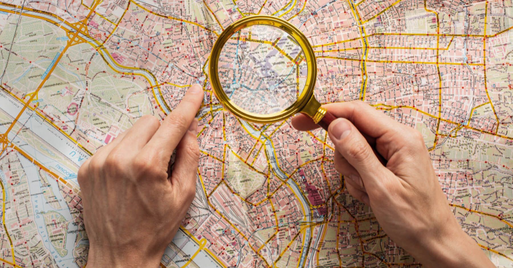 Magnifier glass over a detailed map